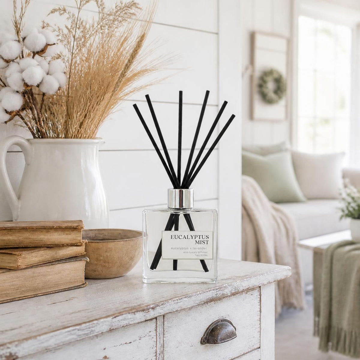 Reed diffuser displayed in a farmhouse living room setting