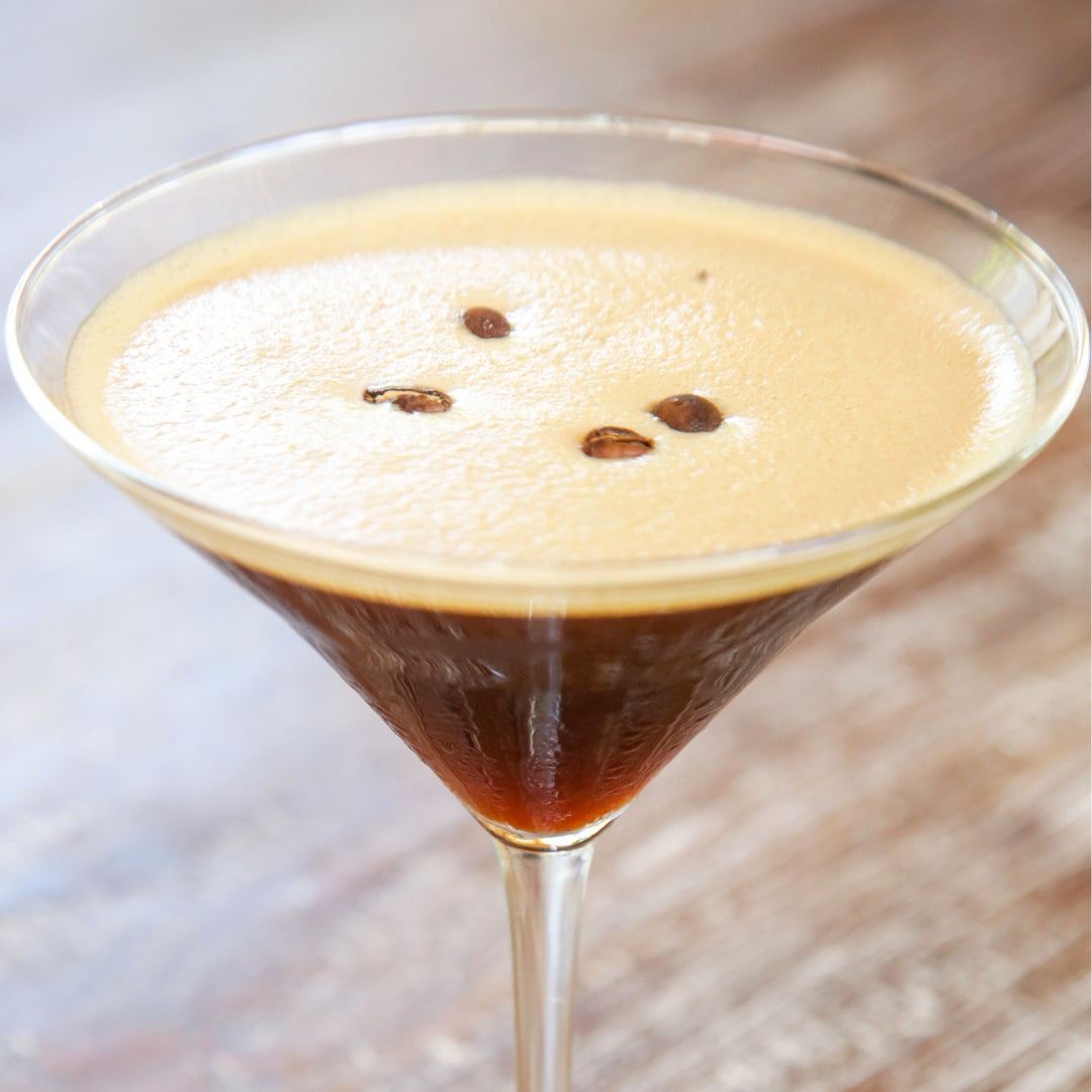 Photo of an espresso martini in a glass.