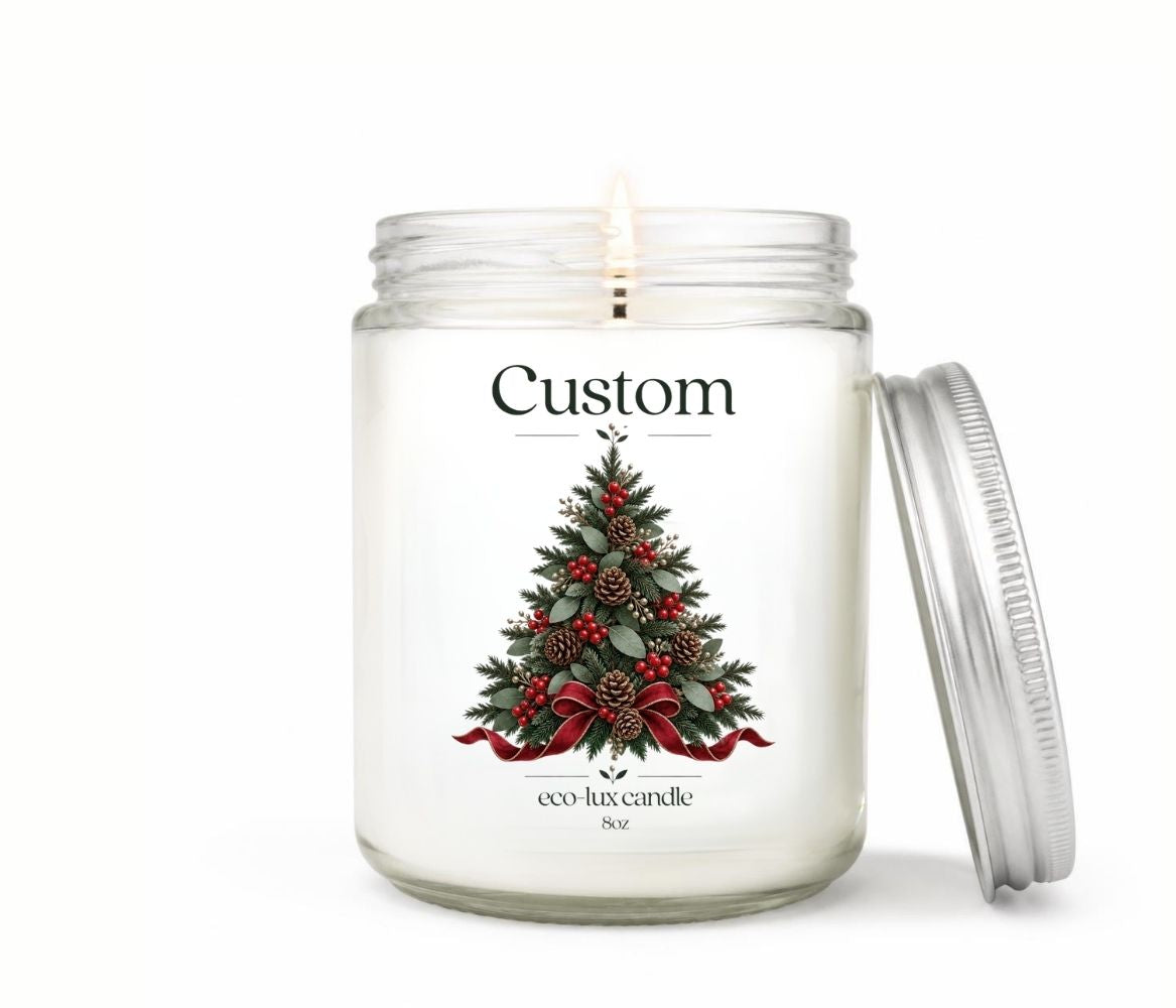 Personalized 8oz Christmas candle in a clear glass jar with an evergreen tree label, pinecones, red berries and bow, silver lid leaning beside it