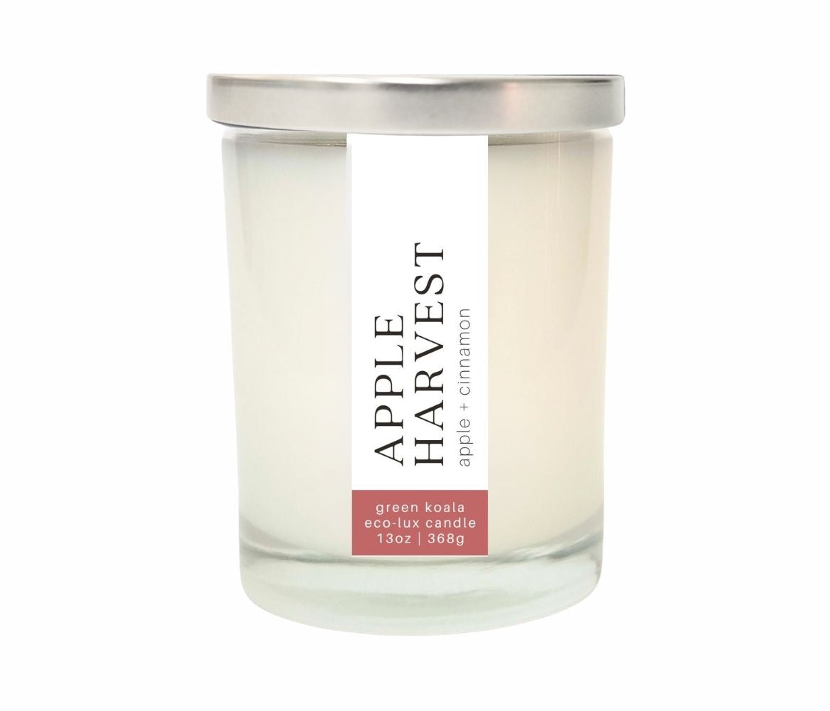 13oz Apple Harvest Zero waste coconut wax candle in a glass jar with a silver lid.