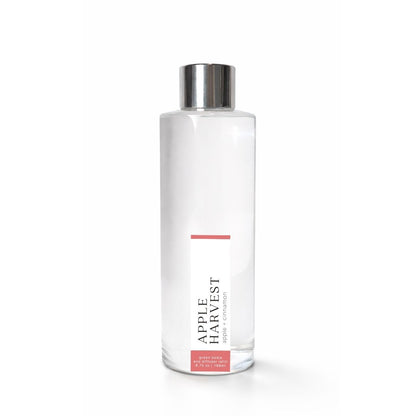 Clear bottle with Apple Harvest silver cap on a white background
