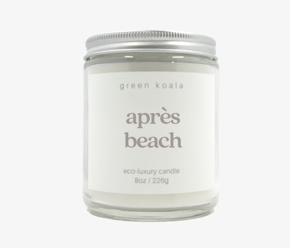 8oz Après Beach Candle in a glass jar with silver lid. 