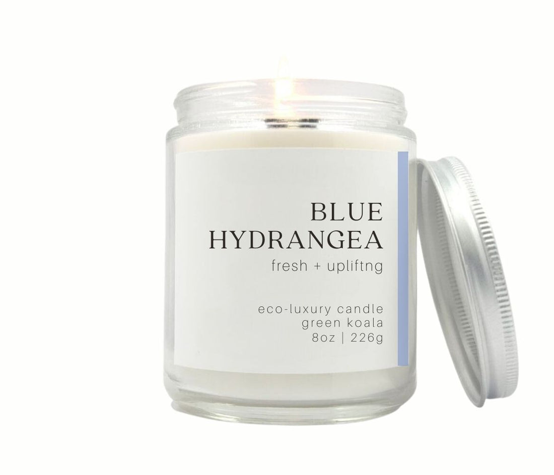 8oz Blue Hydrangea coconut wax candle in a jae with a silver lid. 