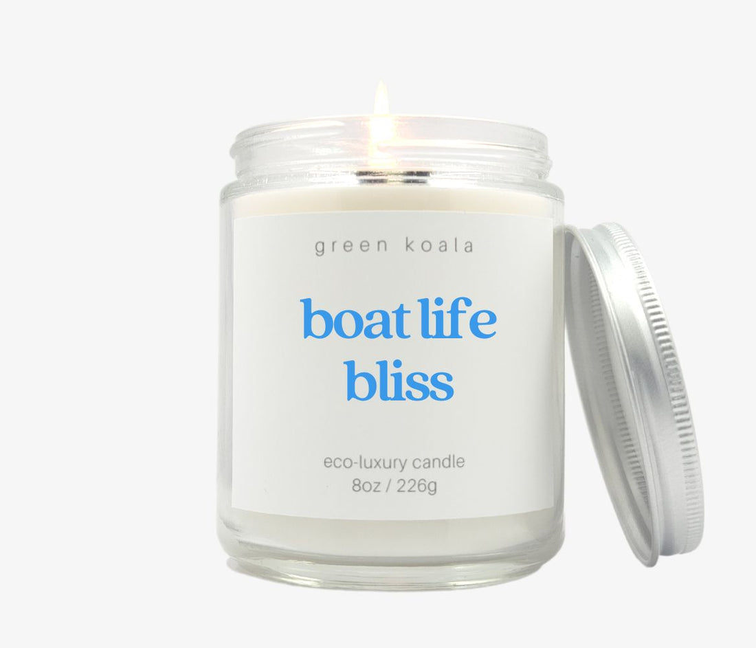 8oz Boat Life Bliss ocean scented candle in a glass jar with silver lid. Made with coconut wax.