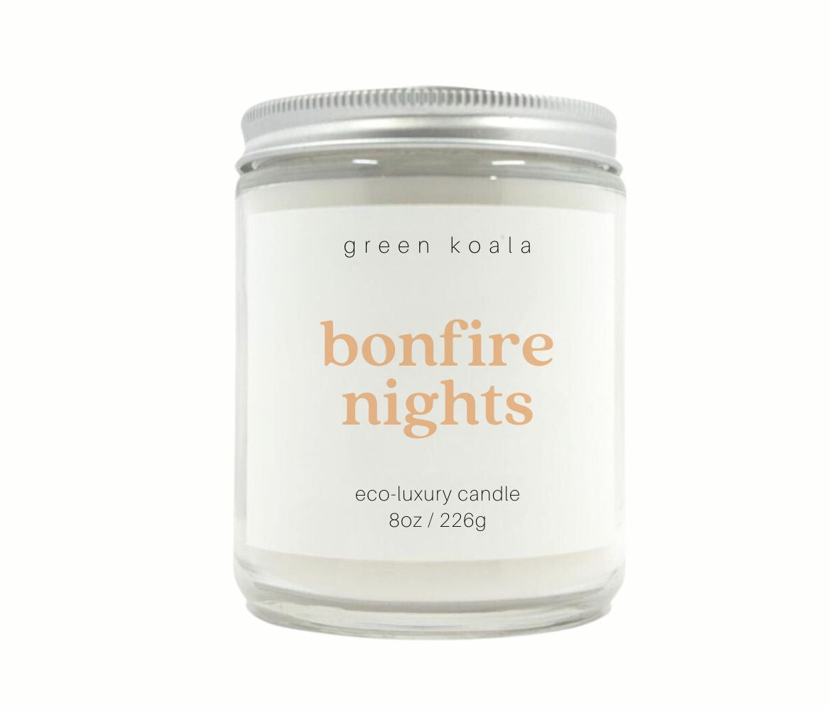 Green Koala 8oz bonfire nights candles in a glass jar. with silver lid giving a cozy woodsy scent.