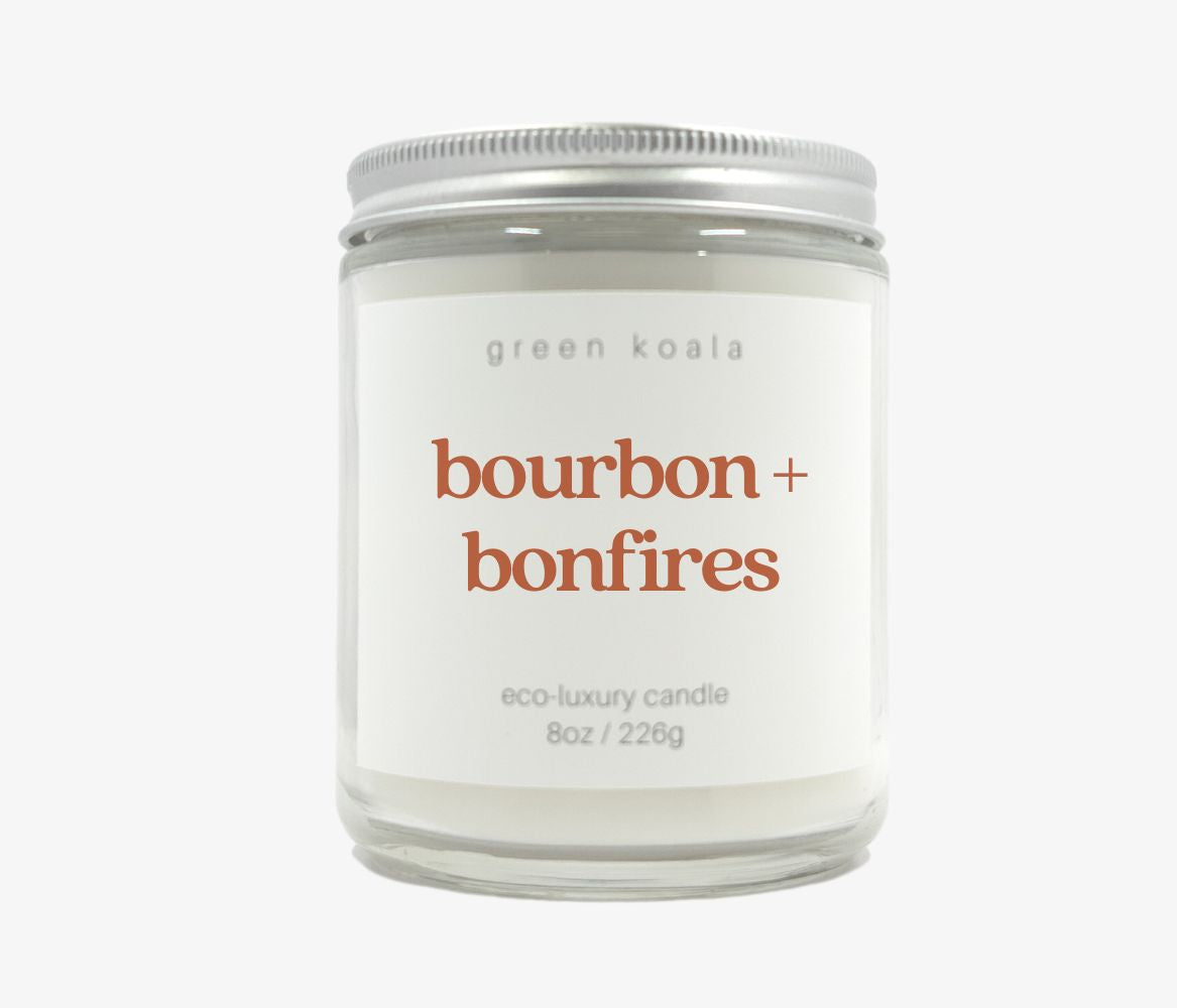 8oz Bourbon + bonfires candle in glass jar with silver lid made with coconut wax .