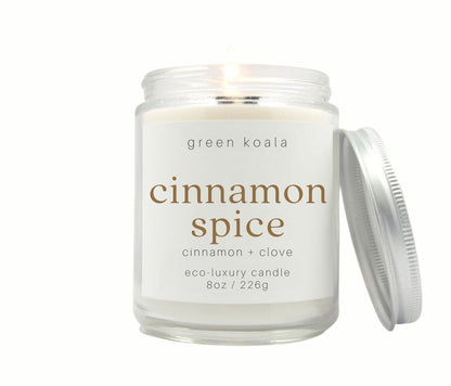 8oz Cinnamon Spice scented non-toxic handmade candle in a glass jar with silver lid.