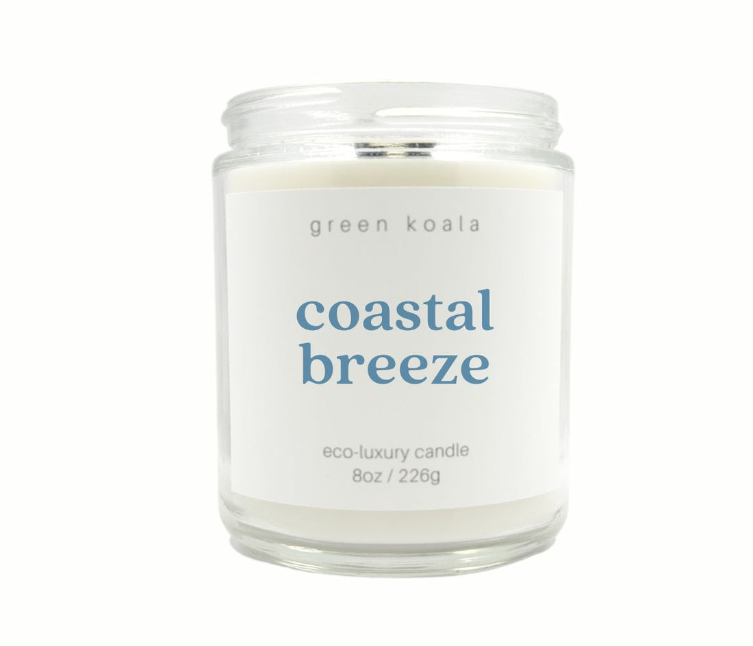 Candle in a glass jar labeled &