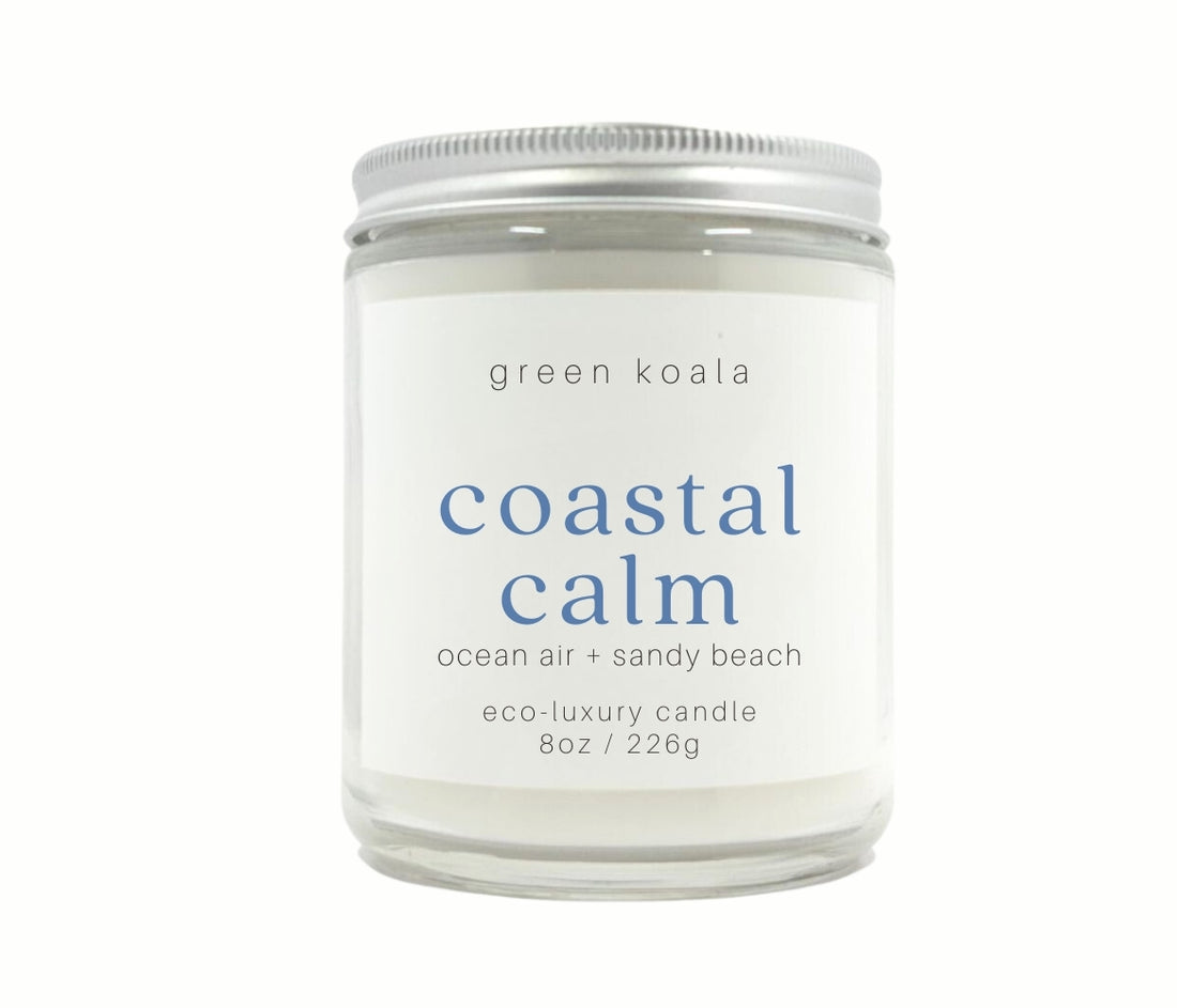 8oz Coastal Calm scented non-toxic hand poured candle in a glass jar with silver lid.