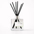 Reed diffuser labeled &