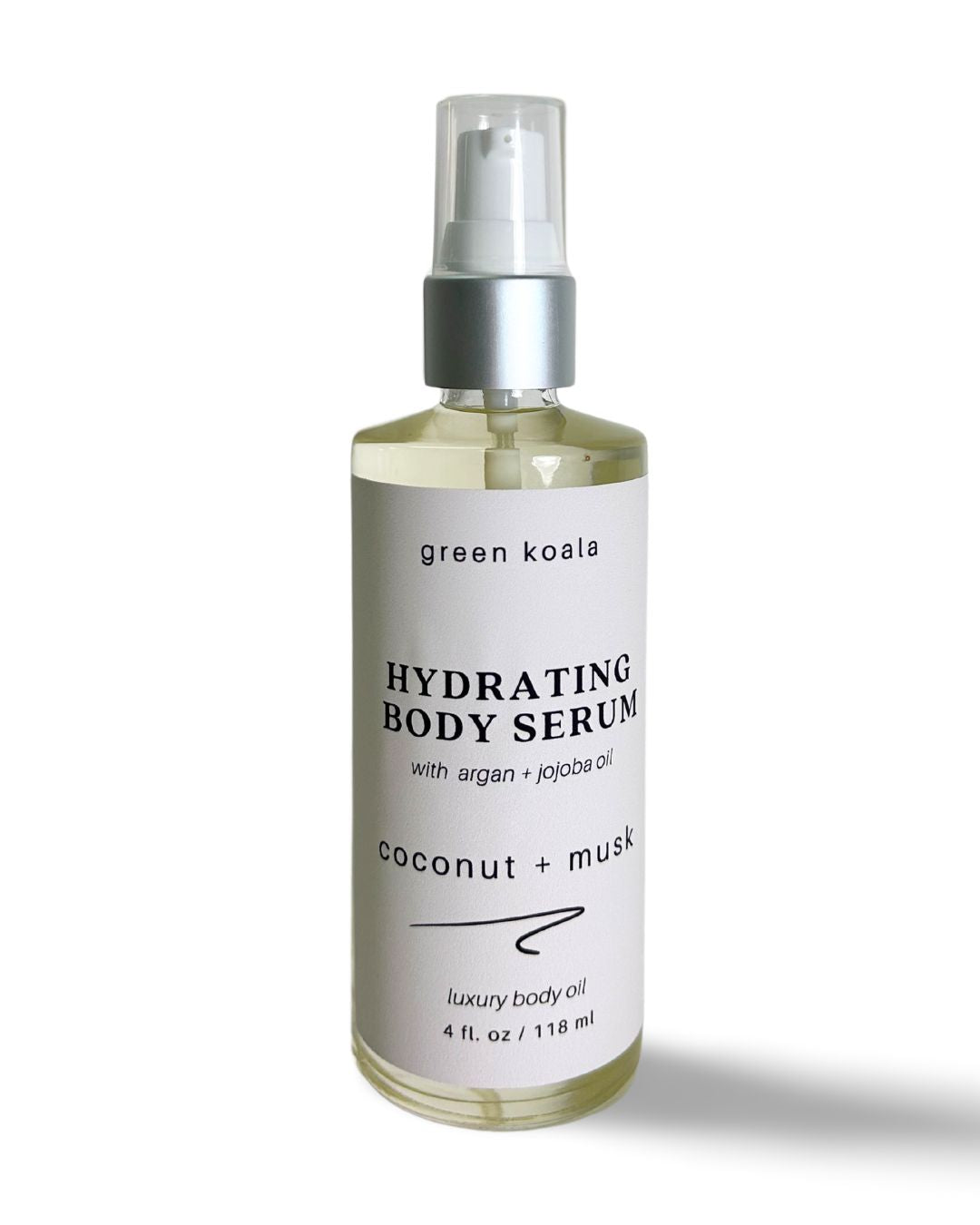 A 4oz glass bottle with treatment pump of organic hydrating body serum for dry skin in coconut + musk scent.