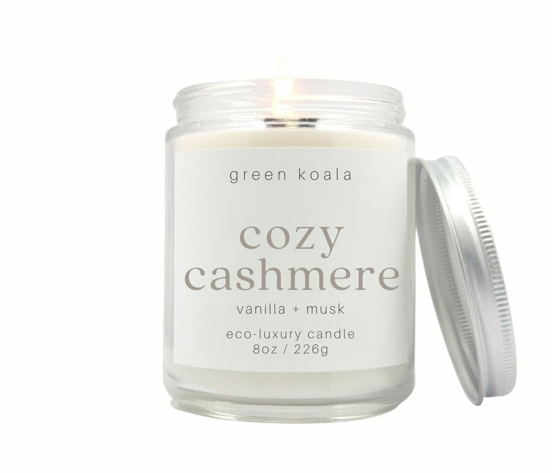 8oz Cozy Cashmere scented non-toxic and clean burning candle in a glass jar with silver lid.