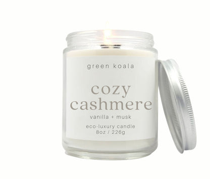 8oz Cozy Cashmere scented non-toxic and clean burning candle in a glass jar with silver lid. 