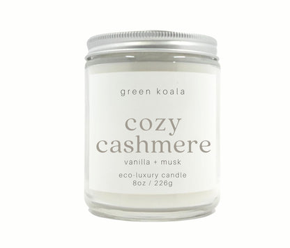 8oz Coastal Calm scented non-toxic hand poured candle in a glass jar with silver lid. 