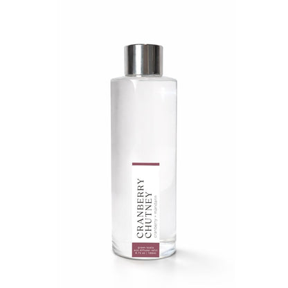 Clear bottle with silver cap labeled Cranberry Chutney on a white background