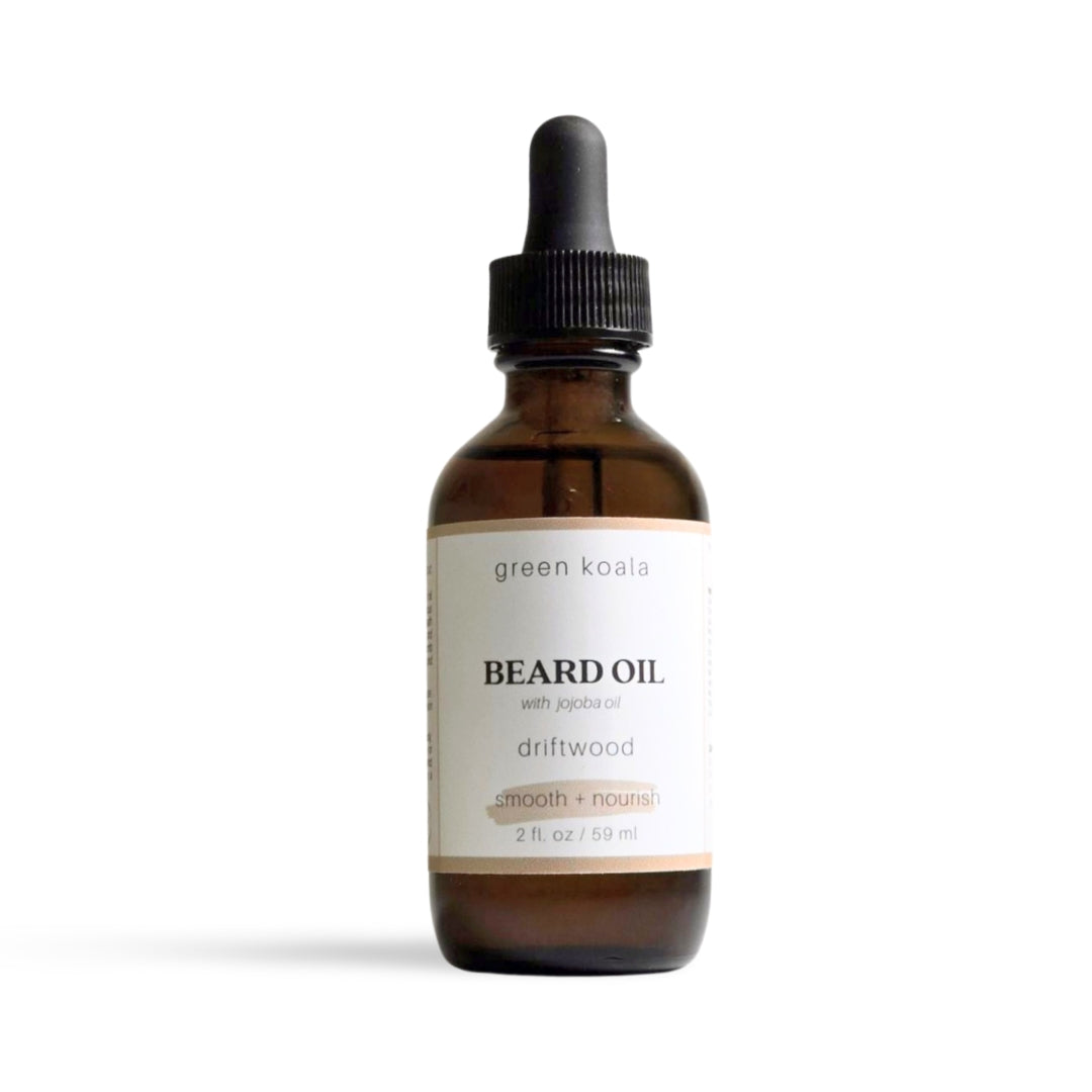 Green Koala® Driftwood Beard Oil in an amber bottle, offering a nourishing, woodsy scent for a soft, healthy beard