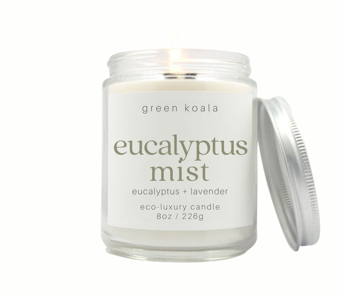 8oz Eucalyptus Mist scented non-toxic and clean burning candle in a glass jar with silver lid. 