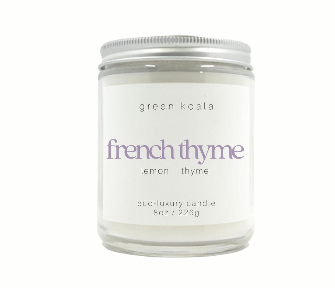 8oz French Thyme scented non-toxic hand poured candle in a glass jar with silver lid. 