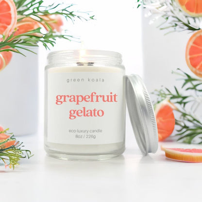 Grapefruit gelato candle with fruit and greens in background