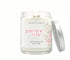Candle jar with jasmine & rose label on a white background