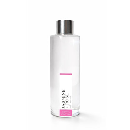 Clear bottle with silver cap labeled Jasmine + Rose
on a white background