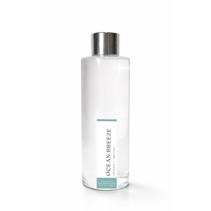 Clear bottle with silver cap labeled &