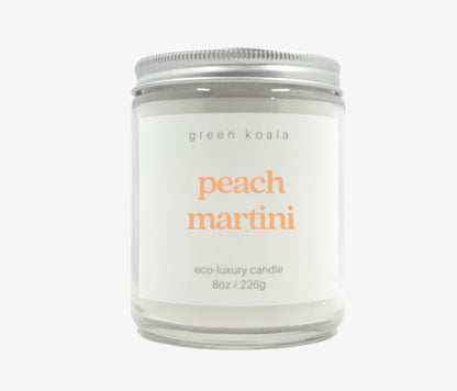 8oz peach martini scented candle in a glass jar made with coconut wax.