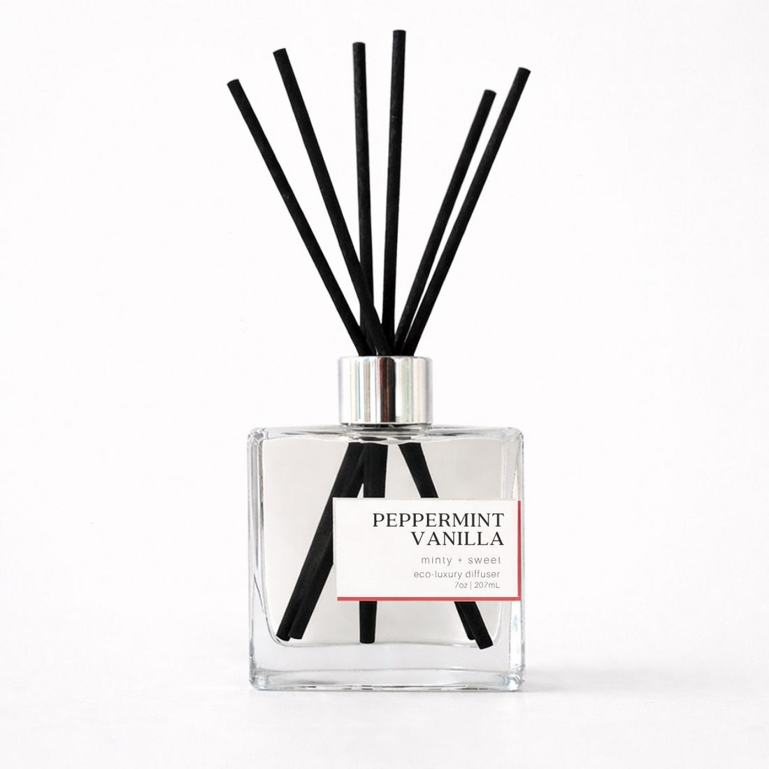 Reed diffuser bottle labeled &