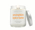 Green Koala Pumpkin Spice Latte 8 oz. candle burning with lid to the side