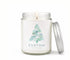 Green Koala personalized sea glass Christmas tree 8oz candle with custom coastal town name label, lit, with silver lid on a white background