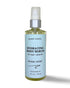 A 4oz glass bottle with treatment pump of organic hydrating body serum for dry skin in stress relief scent.