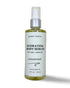 A 4oz glass bottle with treatment pump of organic unscented hydrating body serum for dry skin.