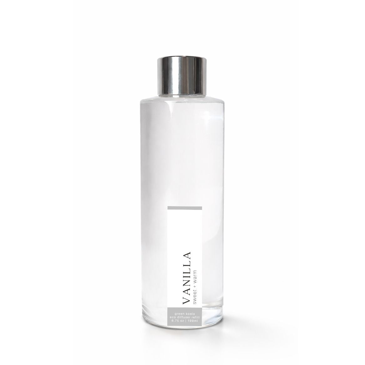 Clear glass bottle with silver cap labeled Vanilla on a white background